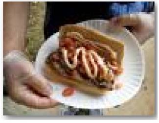 The honey-lime grilled chicken breast with salsa and chipotle sour cream on a  whole grain roll is one of the latest culinary specialties on the Blackstone Valley Tech concession  stand menu. Culinary Arts students raise funds for their senior trip and gain hands-on experience by  managing the concession stand during home football games.