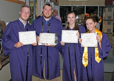 Construction Technology grad Daniel Brochu and Manufacturing & Engineering Technology grad Russell Poirier, both of Upton, joined Business Technology grad Sarah Trudeau of Northbridge and Cosmetology grad Emma Sexton of Upton in proudly displaying their student-achievement awards.
